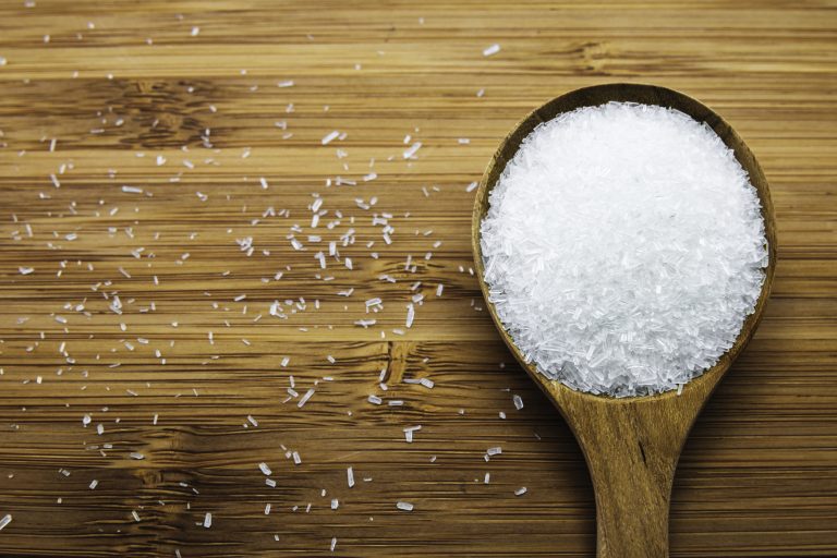 Monosodium glutamate (MSG) on wooden spoon